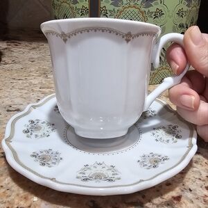Elegant White and Gold Teacup with Saucer